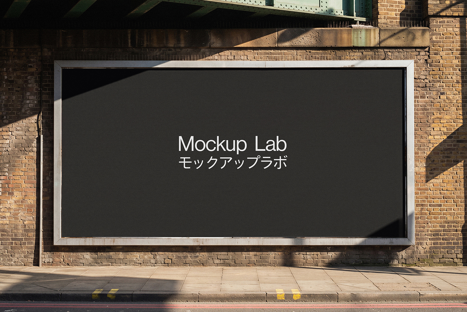 Front view of a large billboard mockup against a clear blue sky, showcasing a design.